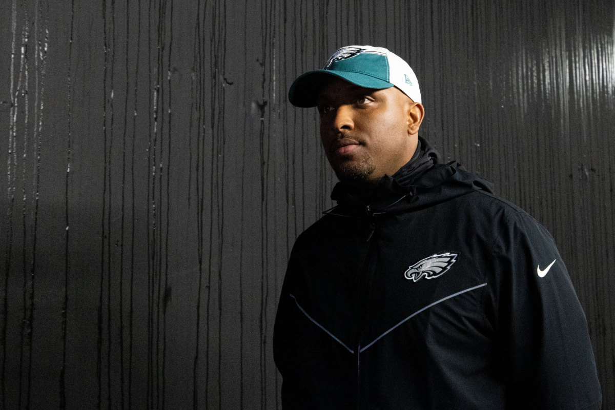 Philadelphia Eagles offensive coordinator Brian Johnson walks out of the tunnel for a game.